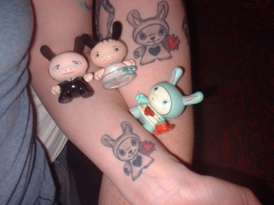 Tattoos inspired by art: Dunny by Tara Mcpherson. Flesh canvas(es) by Kevin and his wife. Awwwww!
