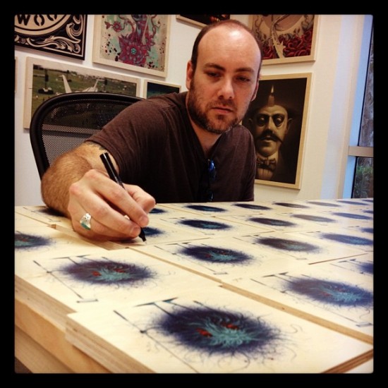 @jeffsotoart signing his latest batch of affordable prints on wood.